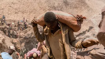 An artisanal miner carries a sack of ore at the Shabara artisanal mine near Kolwezi in the Democratic Republic of Congo on Oct.12, 2022.
