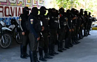 Members of the National Police prepare before going out to patrol the streets of Duran, city neighbouring Guayaquil, Ecuador, on Nov. 5, 2022. Special police forces continued on Friday, Nov. 4, 2022 to transfer imprisoned criminal gang leaders who have unleashed terror in Guayaquil as part of the government's "open war" against drug trafficking. Photo by RODRIGO BUENDIA/AFP via Getty Images