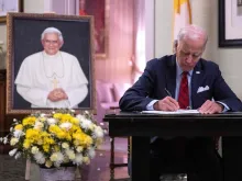 U.S. President Joe Biden signs the condolence book for Pope Emeritus Benedict XVI at the Apostolic Nunciature of the Holy See in Washington, D.C., on Jan. 5, 2023.