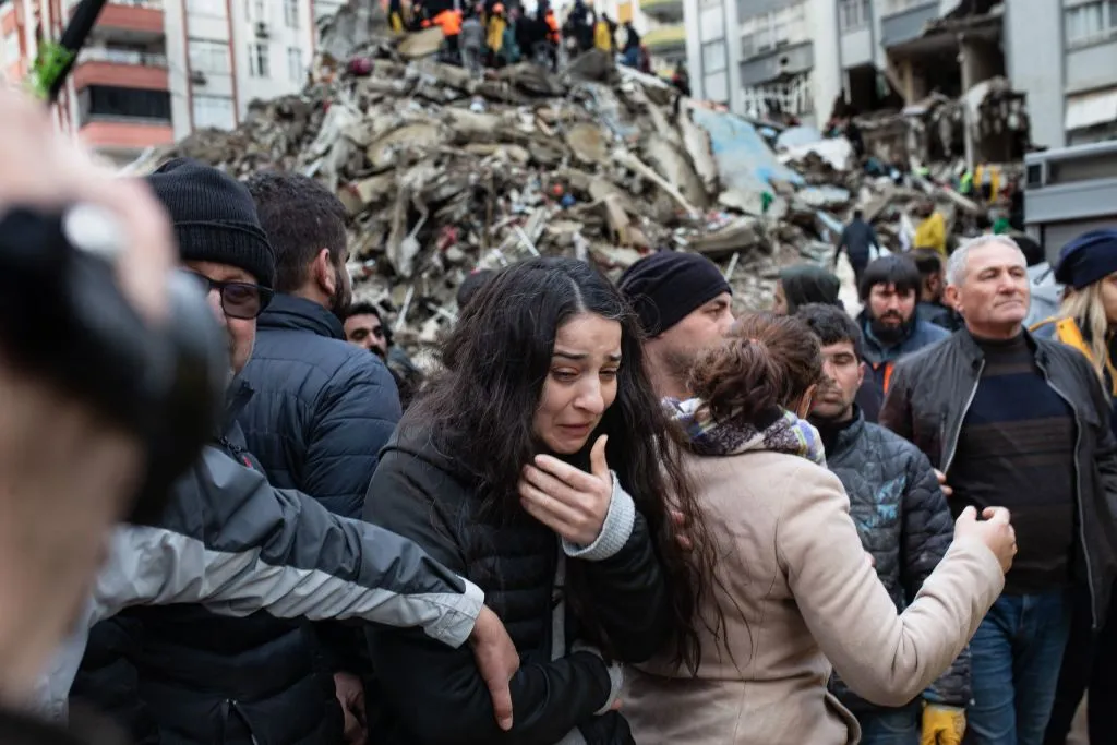 A woman reacts as rescuers search for survivors through the rubble of collapsed buildings in Adana, Turkey, on Feb. 6, 2023, after a 7.8-magnitude earthquake struck the country’s southeast. The combined death toll for Turkey and Syria after the region’s strongest quake in nearly a century is in the thousands.?w=200&h=150