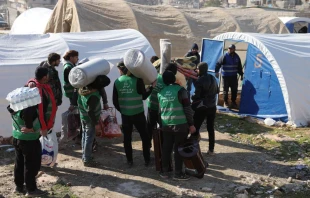 Syrians build a temporary camp to house families made homeless by a deadly earthquake in the town of Harim in Syria’s rebel-held northwestern Idlib province on the border with Turkey, on Feb. 8, 2023, two days after a deadly earthquake that hit Turkey and Syria. Photo by OMAR HAJ KADOUR/AFP via Getty Images