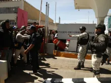 Migrants, mostly of Venezuelan origin, attempt to forcibly cross into the United States at the Paso del Norte International Bridge in Ciudad Juarez, Chihuahua state, Mexico, on March 12, 2023.