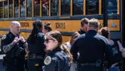 School buses with children arrive at Woodmont Baptist Church to be reunited with their families after a mass shooting at The Covenant School on March 27, 2023, in Nashville, Tennessee. According to initial reports, three students and three adults were killed by the shooter, a 28-year-old woman. The shooter was killed by police responding to the scene.