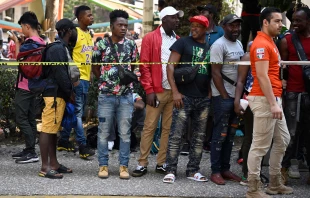 Migrants, mostly Haitians, wait in Mexico City to be sent to different migration centers in Puebla, Hidalgo, and Queretaro to obtain their humanitarian visas, which will allow them to continue their journey to the U.S. border ion March 31, 2023. Credit: ALFREDO ESTRELLA/AFP via Getty Images