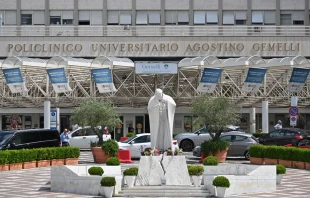 This photograph taken on June 11, 2023, shows the statue of the late Pope John Paul II at the entrance to the Gemelli hospital in Rome. Pope Francis underwent an operation for an abdominal hernia on June 7, 2023, at the Rome hospital. Credit: ALBERTO PIZZOLI/AFP via Getty Images