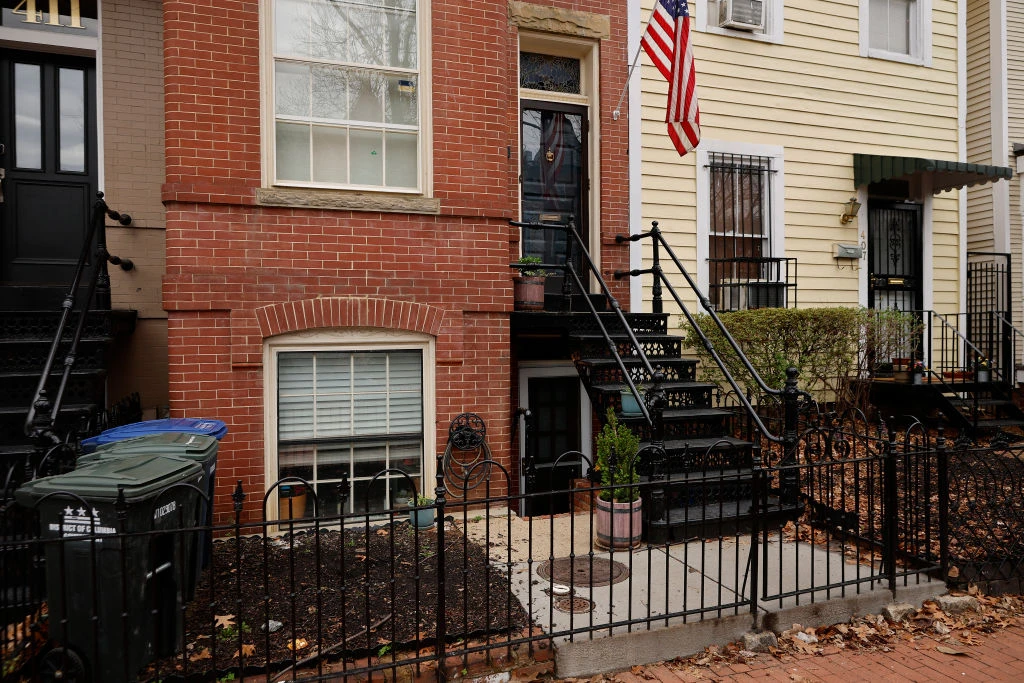 A red-brick row house (C) is seen where DC Metro Police said they found five fetuses inside where anti-abortion activists were living earlier this week in the Capitol Hill neighborhood on April 01, 2022 in Washington, DC. Nine people, some of whom lived or stayed in the house, were indicted Wednesday on federal civil rights counts, with prosecutors alleging that they violated the Freedom of Access to Clinic Entrances Act when they blockaded an abortion clinic with chain and rope in 2020. Authorities do not know how the fetuses were obtained or how they got into the home where anti-abortion activist Lauren Handy was staying before she was arrested.?w=200&h=150