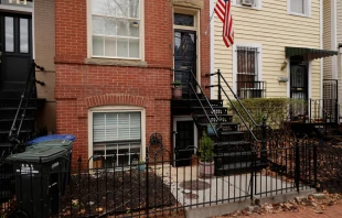 A red-brick row house (C) is seen where DC Metro Police said they found five fetuses inside where anti-abortion activists were living earlier this week in the Capitol Hill neighborhood on April 01, 2022 in Washington, DC. Nine people, some of whom lived or stayed in the house, were indicted Wednesday on federal civil rights counts, with prosecutors alleging that they violated the Freedom of Access to Clinic Entrances Act when they blockaded an abortion clinic with chain and rope in 2020. Authorities do not know how the fetuses were obtained or how they got into the home where anti-abortion activist Lauren Handy was staying before she was arrested. Chip Somodevilla/Getty Images
