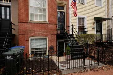 GETTY A red-brick row house (C) is seen where DC Metro Police said they found five fetuses inside where anti-abortion activists were living earlier this week in the Capitol Hill neighborhood on April 01, 2022 in Washington, DC.