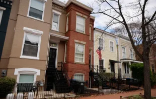 A red-brick row house (C) is seen where DC Metro Police said they found five fetuses inside where anti-abortion activists were living earlier this week in the Capitol Hill neighborhood on April 01, 2022 in Washington, DC. Nine people, some of whom lived or stayed in the house, were indicted Wednesday on federal civil rights counts, with prosecutors alleging that they violated the Freedom of Access to Clinic Entrances Act when they blockaded an abortion clinic with chain and rope in 2020. Authorities do not know how the fetuses were obtained or how they got into the home where anti-abortion activist Lauren Handy was staying before she was arrested. Chip Somodevilla/Getty Images