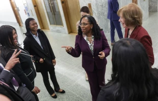 U.S. Supreme Court Nominee Ketanji Brown Jackson (C) meets staff members of Sen. Tina Smith (D-MN) (R) on Capitol Hill April 04, 2022 in Washington, DC. The Senate Judiciary Committee is meeting today to hold a vote on the nomination of Jackson. If approved by the committee, the full Senate is expected to vote later this week. Kevin Dietsch/Getty Images.