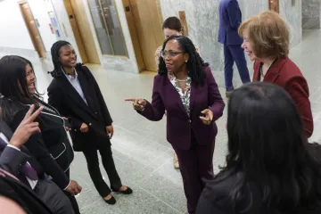 GETTY U.S. Supreme Court Nominee Ketanji Brown Jackson (C) meets staff members of Sen. Tina Smith (D-MN) (R) on Capitol Hill April 04, 2022 in Washington, DC. The Senate Judiciary Committee is meeting today to hold a vote on the nomination of Jackson.