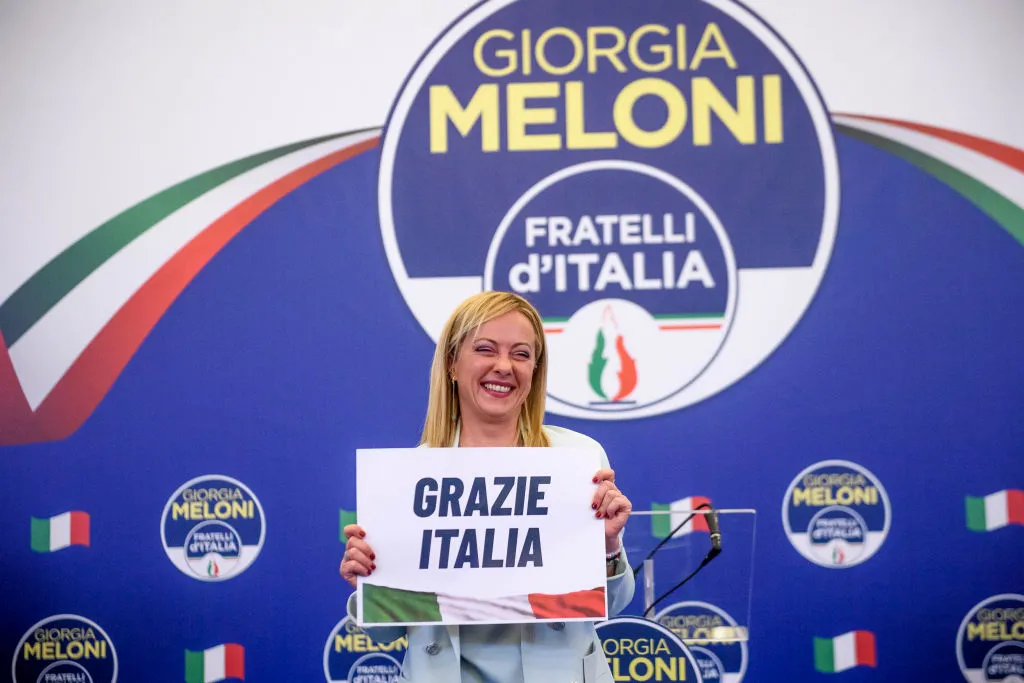 Giorgia Meloni, leader of the Fratelli d'Italia (Brothers of Italy) holds a “Thank You Italy” sign during a press conference at the party electoral headquarters on Sept. 25, 2022 in Rome.?w=200&h=150
