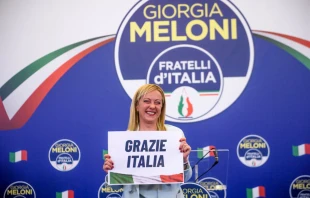 Giorgia Meloni, leader of the Fratelli d'Italia (Brothers of Italy) holds a “Thank You Italy” sign during a press conference at the party electoral headquarters on Sept. 25, 2022 in Rome. Photo by Antonio Masiello/Getty Images