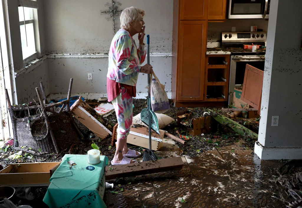 A woman looks over her apartment after floodwater inundated it when Hurricane Ian passed through the area on Sept. 29, 2022 in Fort Myers, Florida. The hurricane brought high winds, storm surge, and rain to the area, causing severe damage.?w=200&h=150