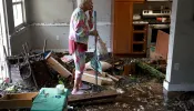 A woman looks over her apartment after floodwater inundated it when Hurricane Ian passed through the area on Sept. 29, 2022 in Fort Myers, Florida. The hurricane brought high winds, storm surge, and rain to the area, causing severe damage.