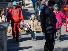 Venezuelan immigrants arrive to the U.S.-Mexico border to try to cross into the United States on Jan. 8, 2023, from Ciudad Juarez, Mexico.