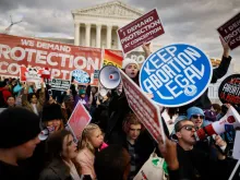 Pro-life and abortion rights activists protest during the 50th annual March for Life rally in front of the U.S. Supreme Court on Jan. 20, 2023, in Washington, D.C.