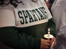Michigan State University students attend a prayer service on Feb. 14, 2023, for those killed and injured at the university in East Lansing, Michigan, on Feb. 13, 2023.