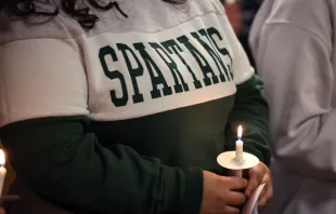 Michigan State University students attend a prayer service on Feb. 14, 2023, for those killed and injured at the university in East Lansing, Michigan, on Feb. 13, 2023. Photo by Scott Olson/Getty Images