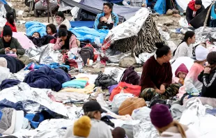 Immigrants gather at a makeshift camp stranded between border walls between the U.S. and Mexico on May 13, 2023, in San Diego, California. Photo by Mario Tama/Getty Images