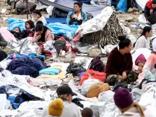 Immigrants gather at a makeshift camp stranded between border walls between the U.S. and Mexico on May 13, 2023, in San Diego, California.