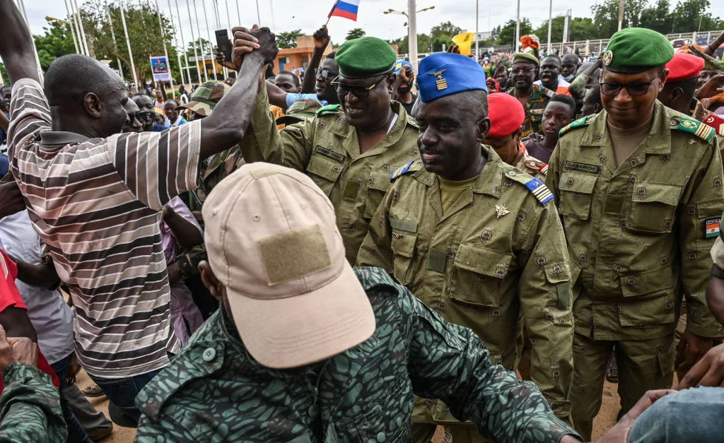 Niger's National Council for the Safeguard of the Homeland  Colonel-Major Amadou Abdramane (center), General Mohamed Toumba (center-left), and Colonel Ousmane Abarchi (right) are greeted upon their arrival at the Stade General Seyni Kountche in Niamey, Niger, on Aug. 6, 2023.?w=200&h=150