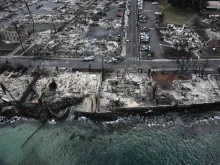 An aerial image taken on Aug. 10, 2023, shows destroyed homes and buildings burned to the ground in Lahaina along the Pacific Ocean in the aftermath of wildfires in western Maui, Hawaii.