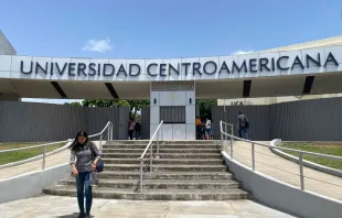 A woman exits the Universidad Centroamericana (Central American University) in Managua on Aug. 16, 2023. The Jesuit Central American University (UCA) of Nicaragua announced the suspension of all its activities after a court ordered the confiscation of its assets and funds after accusing it of being a "center of terrorism." Credit: STRINGER/AFP via Getty Images