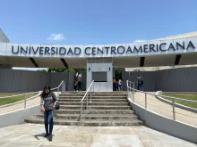 A woman exits the Universidad Centroamericana (Central American University) in Managua on Aug. 16, 2023. The Jesuit Central American University (UCA) of Nicaragua announced the suspension of all its activities after a court ordered the confiscation of its assets and funds after accusing it of being a "center of terrorism."