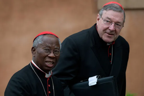 Australian Cardinal George Pell (R) and Nigerian Cardinal Francis Arinze arrive for a meeting on the eve of the start of a conclave on March 11, 2013, at the Vatican. Photo by JOHANNES EISELE/AFP via Getty Images