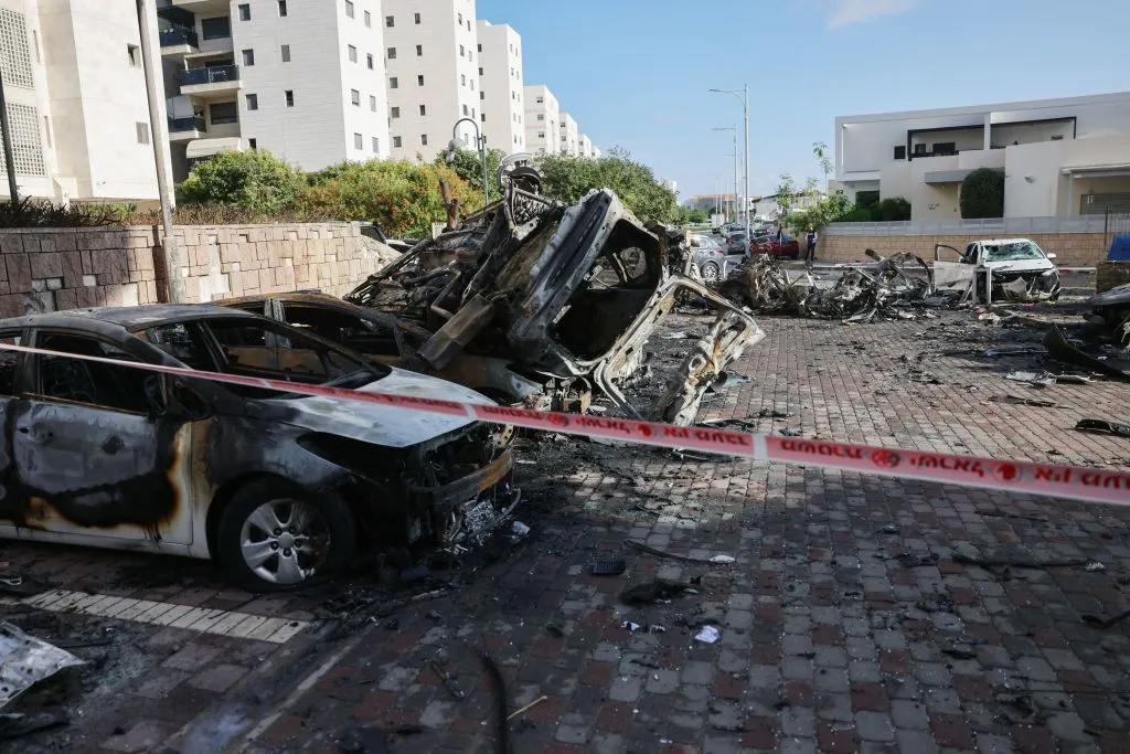A picture taken in the southern Israeli city of Ashkelon on Oct. 7, 2023, shows burnt-out vehicles outside a residential building hit in a rocket attack from the Gaza Strip.?w=200&h=150