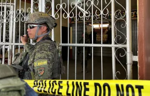 Military personnel stand guard at the entrance of a gymnasium while police investigators look for evidence after a bomb attack at a Catholic Mass at Mindanao State University in Marawi, Lanao del sur province in the southern Philippines on Dec. 3, 2023. At least three people were killed and seven wounded, officials said. Credit: MERLYN MANOS/AFP via Getty Images