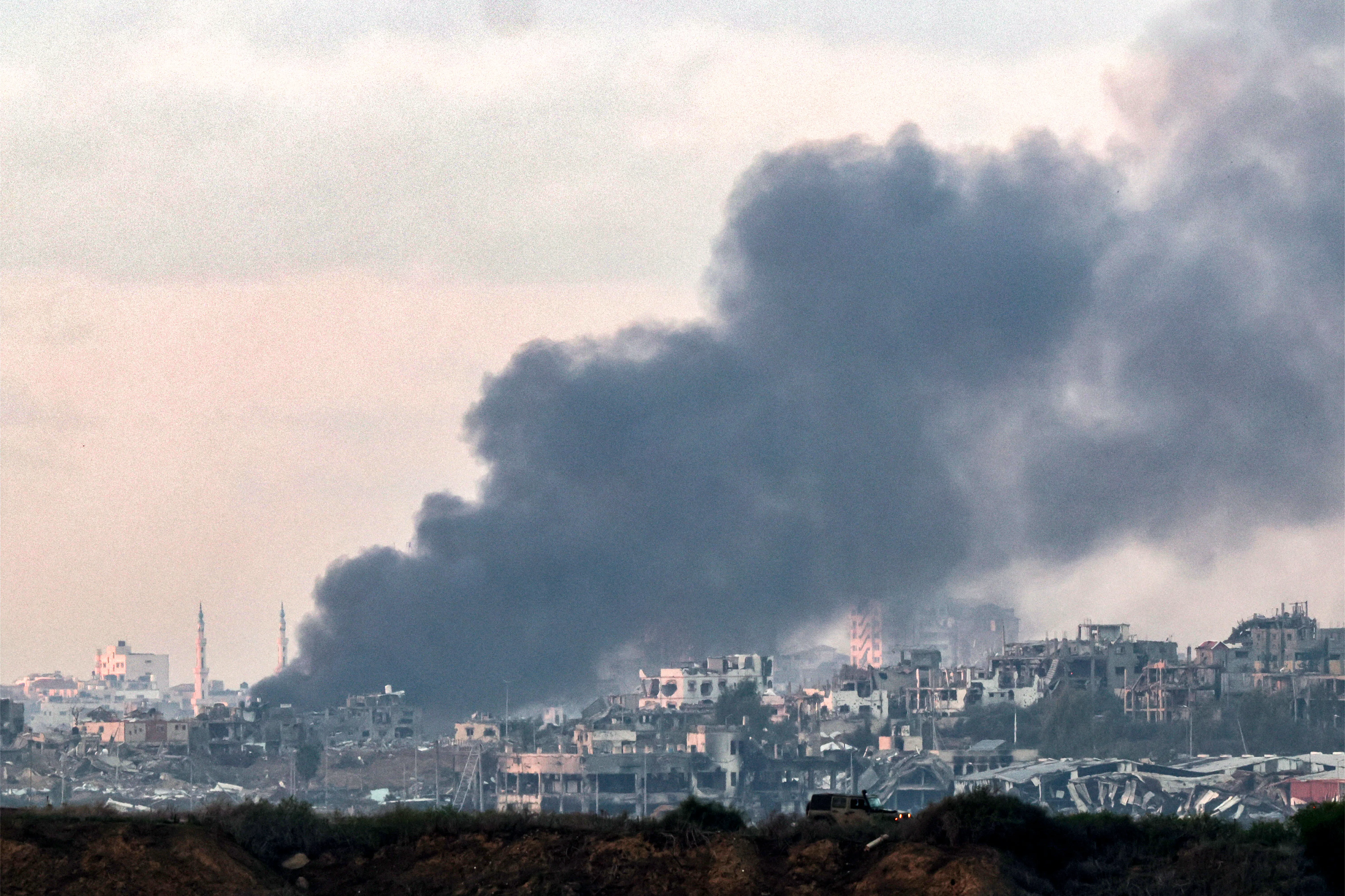 Smoke billows over the northern Gaza Strip during Israeli bombardment from southern Israel on December 14, 2023 amid continuing battles between Israel and the Palestinian militant group Hamas.?w=200&h=150