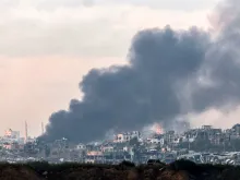 Smoke billows over the northern Gaza Strip during Israeli bombardment from southern Israel on December 14, 2023 amid continuing battles between Israel and the Palestinian militant group Hamas.