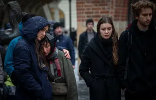 People mourn outside the Charles University building following a mass shooting on Dec. 22, 2023, in Prague, Czech Republic. Fourteen people were killed and 25 injured. Police say the gunman was a 24-year-old student at the university. Credit: Gabriel Kuchta/Getty Images