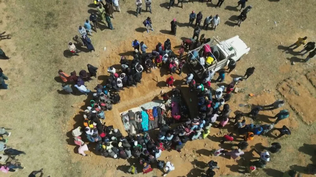 This image made from an AFPTV video taken in the Nigerian village of Maiyanga on Dec. 27, 2023, shows families burying in a mass grave their relatives killed in deadly attacks conducted by armed groups in central Plateau State. The death toll from a series of attacks on villages in central Nigeria has climbed to almost 200, local authorities said.?w=200&h=150