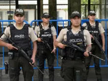 Police officers stand guard outside the City Hall building in Quito on Jan. 10, 2024, as Ecuador remains in a state of emergency following the escape from prison of a dangerous narco boss.