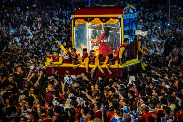 Filipino devotees attempt to touch the carriage carrying the statue of the Black Nazarene during the feast of the Black Nazarene on Jan. 9, 2024, in Manila, Black Nazarene. The traditional daylong procession of the feast of the Black Nazarene resumed after a three-year hiatus due to COVID-19 precautions. Credit: Ezra Acayan/Getty Images