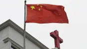 This photo taken on Jan. 15, 2024, shows a Chinese flag fluttering below a cross on a Christian church in Pingtan, in China's southeast Fujian province.