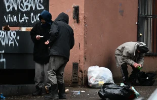 A person holds a foil while smoking following the decriminalization of all drugs, including fentanyl and meth, in downtown Portland, Oregon, on Jan. 25, 2024. Since hard drugs were decriminalized in Oregon three years ago, there are no arrests, just a fine and a card with a telephone number where the user can get help. Credit: PATRICK T. FALLON/AFP via Getty Images