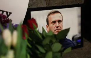 Photographs and flowers are left outside the Russian Embassy in London on Feb. 16, 2024, following the news of the death of Russian opposition leader Alexei Navalny. Credit: DANIEL LEAL/AFP via Getty Images