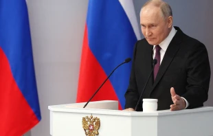 In this pool photograph distributed by Russian state agency Sputnik, Russia's President Vladimir Putin delivers his annual state of the nation address at the Gostiny Dvor conference center in central Moscow on Feb. 29, 2024. Credit: GAVRIIL GRIGOROV/POOL/AFP via Getty Images