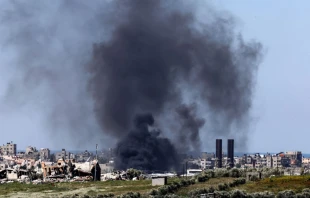 A picture taken from a position in southern Israel on Feb. 29, 2024, shows smoke billowing over the Gaza Strip amid ongoing battles between Israel and the Palestinian militant group Hamas. Credit: JACK GUEZ/AFP via Getty Images