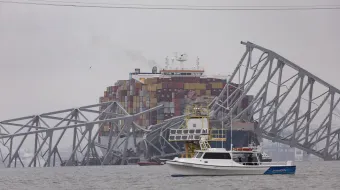 Workers continue to investigate and search for victims after the cargo ship Dali collided with the Francis Scott Key Bridge causing it to collapse yesterday, on March 27, 2024, in Baltimore.