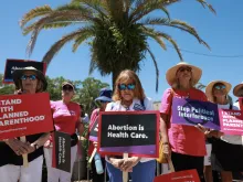 People join together during a “Rally to Stop the Six-Week Abortion Ban” held at Lake Eola Park on April 13, 2024, in Orlando, Florida.