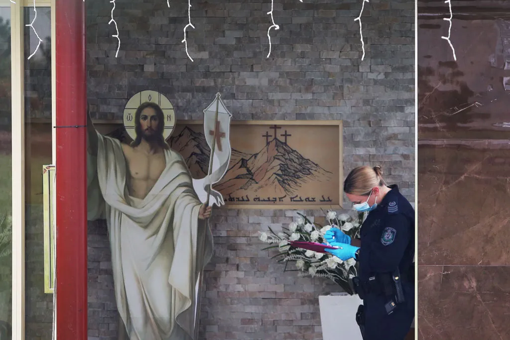 A member of New South Wales Forensic Police is seen at Christ the Good Shepherd Church in the Sydney suburb of Wakeley, Australia, on April 16, 2024. Hundreds clashed with police in western Sydney on April 15 after Bishop Mar Mari Emmanuel was stabbed at the altar. New South Wales police have declared the attack a terror event. Police apprehended a 16-year-old in connection with the attack.?w=200&h=150
