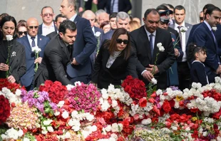 Attendees lay flowers at the Tsitsernakaberd Armenian Genocide Memorial in Yerevan to mark the 109th anniversary of World War I-era mass killings on April 24, 2024. Credit: KAREN MINASYAN/AFP via Getty Images