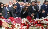 Attendees lay flowers at the Tsitsernakaberd Armenian Genocide Memorial in Yerevan to mark the 109th anniversary of World War I-era mass killings on April 24, 2024.