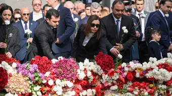 Attendees lay flowers at the Tsitsernakaberd Armenian Genocide Memorial in Yerevan to mark the 109th anniversary of World War I-era mass killings on April 24, 2024.