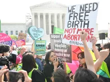 Pro-life and pro-abortion activists at a demonstration outside the U.S. Supreme Court as it hears arguments in the Moyle v. United States case, in Washington, D.C., on April 24, 2024. The case deals with whether an Idaho abortion law conflicts with the federal Emergency Medical Treatment and Labor Act (EMTALA).